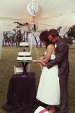 #116- Mr. and Mrs. Dalton cut their cake together.