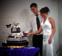#78-Mr. and Mrs. Titus share their wedding cake.